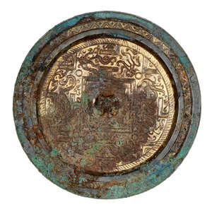 
	
		A Chinese parcel-gilt bronze 'TLV' mirror, Western Han dynasty, 2nd-1st century BC, the...