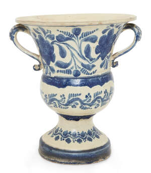 
	
		A Continental glazed pottery two-handled blue and white campana jardiniere, probably 19th...