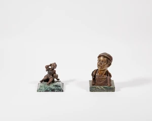 A bronze bust of a street urchin, 20th century, modelled wearing a flat cap, indistinctly signed...