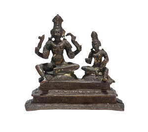 A South Indian figure of Shiva and Parvati Somaskanda, 18th century, on a rectangular tiered base, the four-armed Vishnu seated with a pendant right leg in lal