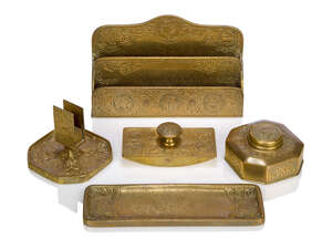 
	
		Tiffany Studios, a Gilt-Bronze Zodiac pattern Desk set  
		Early 20th Century, three...