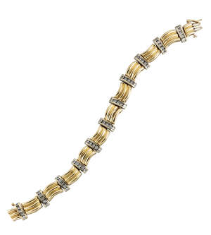 
	
		A diamond-set bracelet, composed of triple bar curved panels with brilliant-cut diamond...
