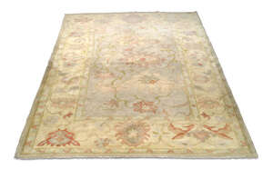 
	
		A modern wool carpet in the manner of Voysey, late 20th Century, with floral designs in...