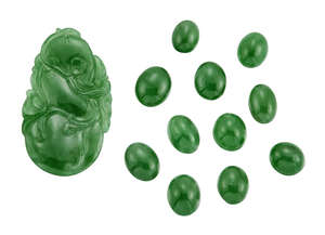
	
		A jadeite jade plaque and eleven unmounted jadeite jade cabochons, the plaque carved as a...