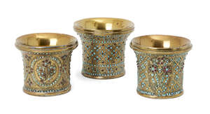 
	
		Three Qajar brass ghalian cups, Iran, 19th century, largest 7.1cm. high (3)
		 
		