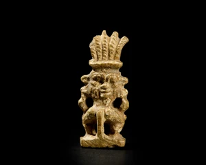 An Egyptian glazed steatite amulet of a janus-headed Bes, Late Period, circa 7th-4th Century...