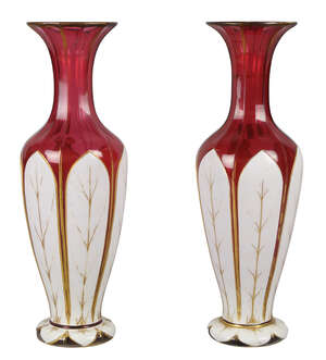 
	
		A pair of Bohemian ruby and white opaline facetted glass vases, late 19th century, the...