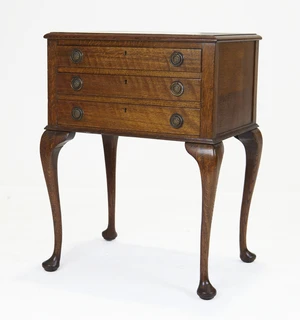 A Mappin and Webb silver plated canteen, for twelve persons, contained in an oak side table,...