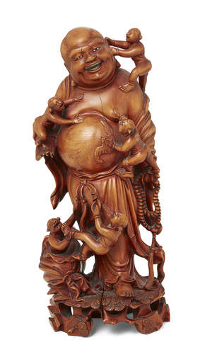 
	
		A Chinese carved wood figure of Budai, late 19th/early 20th century, carved standing with...