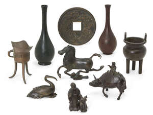 
	
		A group of nine Chinese and Japanese small bronzes, late Ming dynasty-20th century, 
