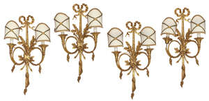 
	
		A set of four gilt bronze twin branch wall lights, 20th Century, each designed with...