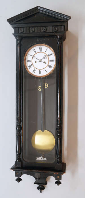 
	
		An ebonised wood Vienna regulator, late 19th century, the case of architectural form with...
