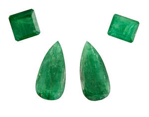 
	
		A group of four unmounted emeralds, comprising: two pear-cut, total weight approximately...