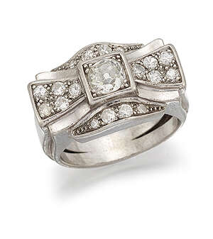 
	
		A 1940's diamond cluster ring, designed as a stylised bow, the old brilliant-cut diamond...