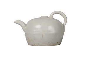 A Chinese Qingbai waterdropper, Song dynasty, of globular form, with high loop handle and angular spout, flat, unglazed base, 9cm long, 6cm high
		 
		 