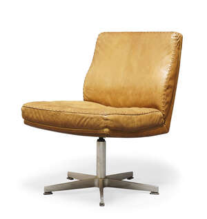 
	
		De Sede, a tan leather swivel lounge chair    
		1960s    
		The square back and seat...