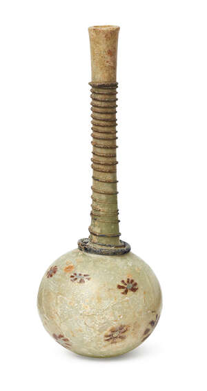 
	
		A millefiori decorated glass bottle, Iran, 12th-13th century, of globular form, with...