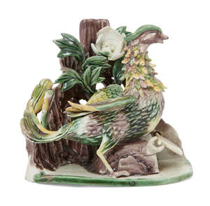 A rare Chinese biscuit porcelain sancai glazed 'erotic' phoenic group, Kangxi period, modelled as a phoenix perched on a roosting box, with flap enclos
