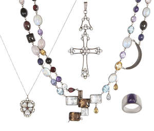
	
		A group of early 20th century silver and later jewellery, comprising; a moonstone and...