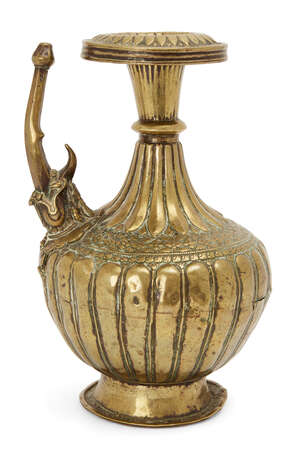 
	
		A moulded brass ewer, North India, 15th-16th century, on a raised splayed foot, the...