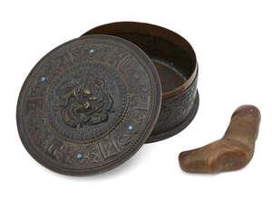 
	
		A Tibetan copper repousse circular reliquary box and cover, 19th century, decorated to...