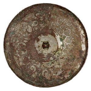 
	
		A Chinese bronze circular mirror, Warring States period, flat cast with intertwined...