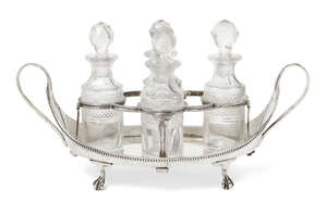 
	
		A George III quatrefoil cruet set, London, c.1784, maker's mark WS, the twin handled...
