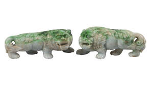 
	
		A pair of Chinese green hardstone lions, early 20th century, 13cm long, (2)

	

