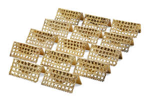 
	
		A set of Stuart Devlin silver gilt place card holders, London, c.1977, comprising...