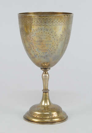 
	
		A Victorian silver wine goblet, London, 1868, engraved with swags of flowers below a band...