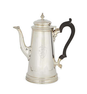 A silver coffee pot, London, c.1943, CJ Vander, of plain tapering form with carved wooden scroll handle, the body with engraved armorial to a raised, stepped l
