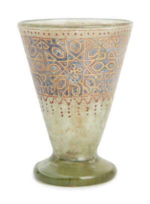 
	
		A Mamluk-style gilded and enamelled glass footed cup with geometric motifs, Egypt or...