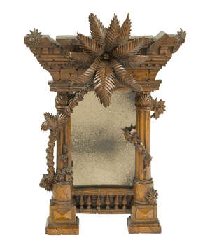 
	
		An Italian carved walnut mirror modelled as a classical ruin, 19th century, the...