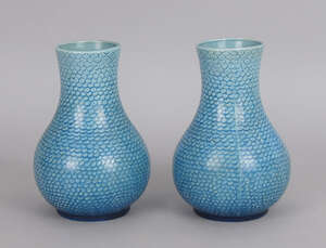 A pair of Continental blue majolica vases, late 19th century, overall decorated with scale decoration, impressed marks to base, 15cm high (2)