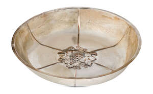 Duchess of Sutherland Cripples Guild, a large silver-plated copper dish
		c.1910, stamped D.S.C.G with coronet
		Embossed with radiating ribs and a central m