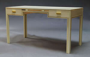 
	
		Pierre Vandel, a cream lacquered desk, c.1970s, the rectangular top above two drawers, on...