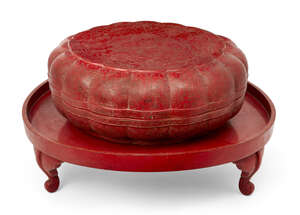 
	
		A large Chinese red lacquer lobed circular box and cover, early 20th century, incised...
