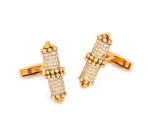 A pair of diamond set cufflinks, of baton form, pav&eacute;-set with diamonds, with beaded accents, to...
