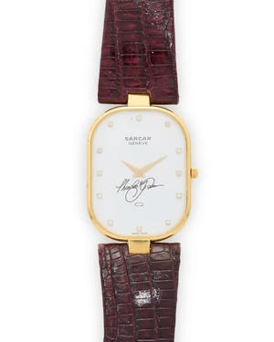 Sarcar. An 18ct gold quartz diamond set wristwatchNumbered 9089-22Quartz movement, white dial with applied diamond dot numerals, oval case with the case held b
