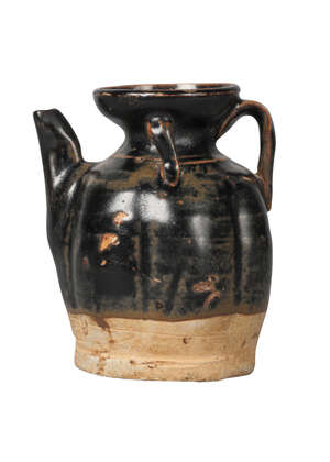 A Chinese black-glazed miniature lobed ewer, Song dynasty, with flared mouth, angular spout, loop handle, and two lugs applied to neck, the brownish-black glaz