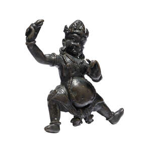 A Tibetan gilt-bronze figure of Vajrapani, 19th century, standing in alidasana, his right hand holding a vajra aloft and his left hand at his chest, wearing a 