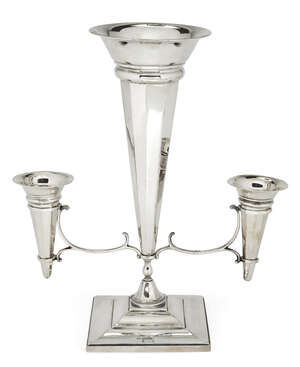 A silver three-branch epergne, Sheffield, c.1920, Alexander Clark & Co., the central trumpet-shaped vase of panelled design to scrolling arms supporting two sm