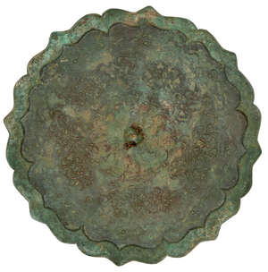 
	
		A Chinese bronze shaped mirror, Northern Song dynasty, the central knob within flowerhead...