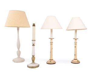 A pair of modern cream painted wood table lamps, each decorated with vine leaves, with paper shade, 33cm high exc. fitment; together with two further cream pai