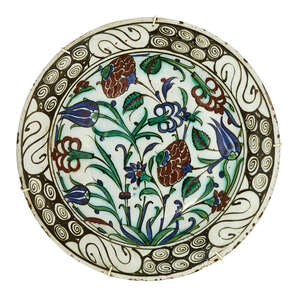 
	
		An Iznik pottery dish, Turkey, circa 1600, underglaze painted in raised red, cobalt blue,...
