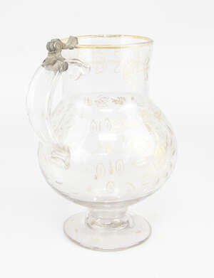 
	
		A Continental glass flagon, late 18th/19th century, of bellied form with pedestal foot...