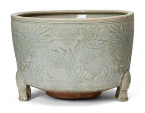 
	
		A large Chinese Longquan celadon tripod censer, Ming dynasty, 16th century, carved to the...