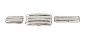 A silver four division cigar case, Birmingham c.1901, William Henry Sparrow, together with a two division cigar case, Chester c.1901, William Neale and a four 