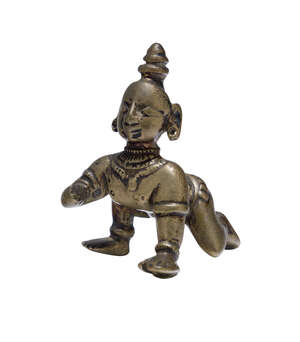 RTOA small bronze statue of Krishna the butter thief, South India, 19th century, depicted crawling forward with one foot in advance, right hand missing, 6cm. h