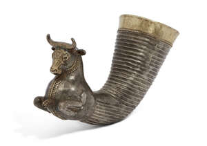 A copy of a Thracian rhyton in the form of a bull, 20th century, the horn-shaped vessel with ribbed body, tapering to terminate in the animal head, with short 